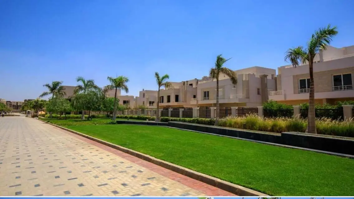 Luxurious Villa with Private Garden and Shared Pool in Prime Location