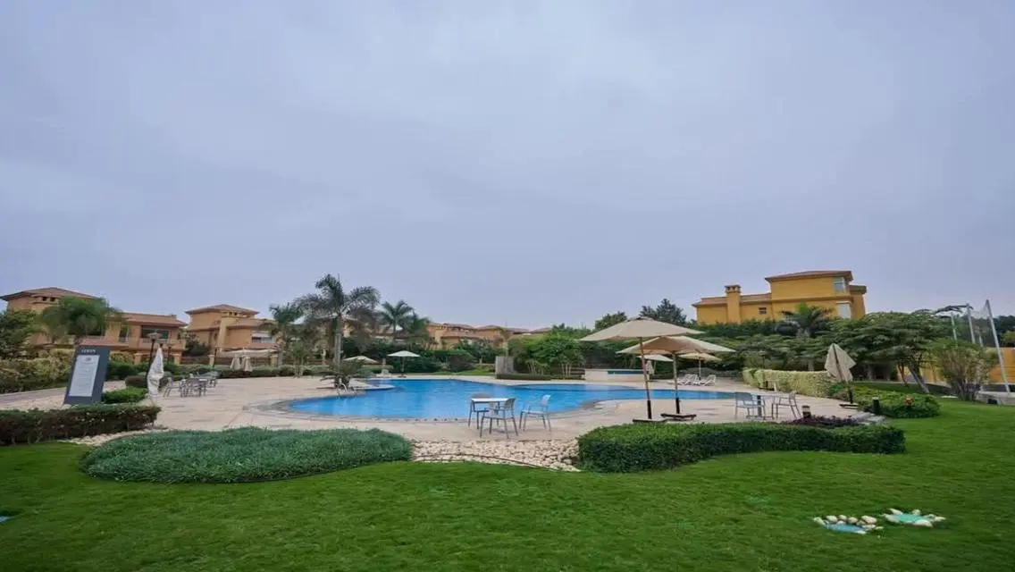 Luxurious Villa with Private Garden and Shared Pool in Prime Location