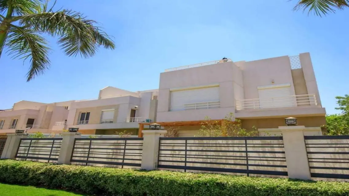 Luxurious Villa with Private Garden and Shared Pool in Prime Location