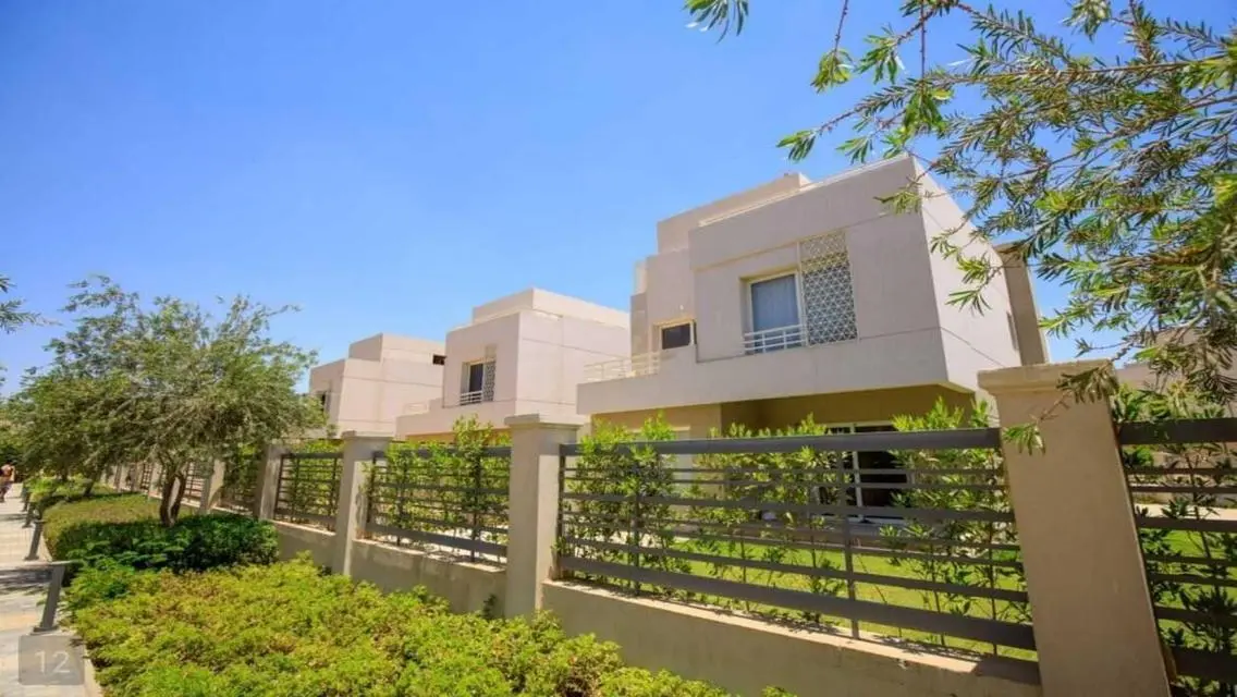 Luxurious Villa with Private Garden and Shared Pool in Prime Location