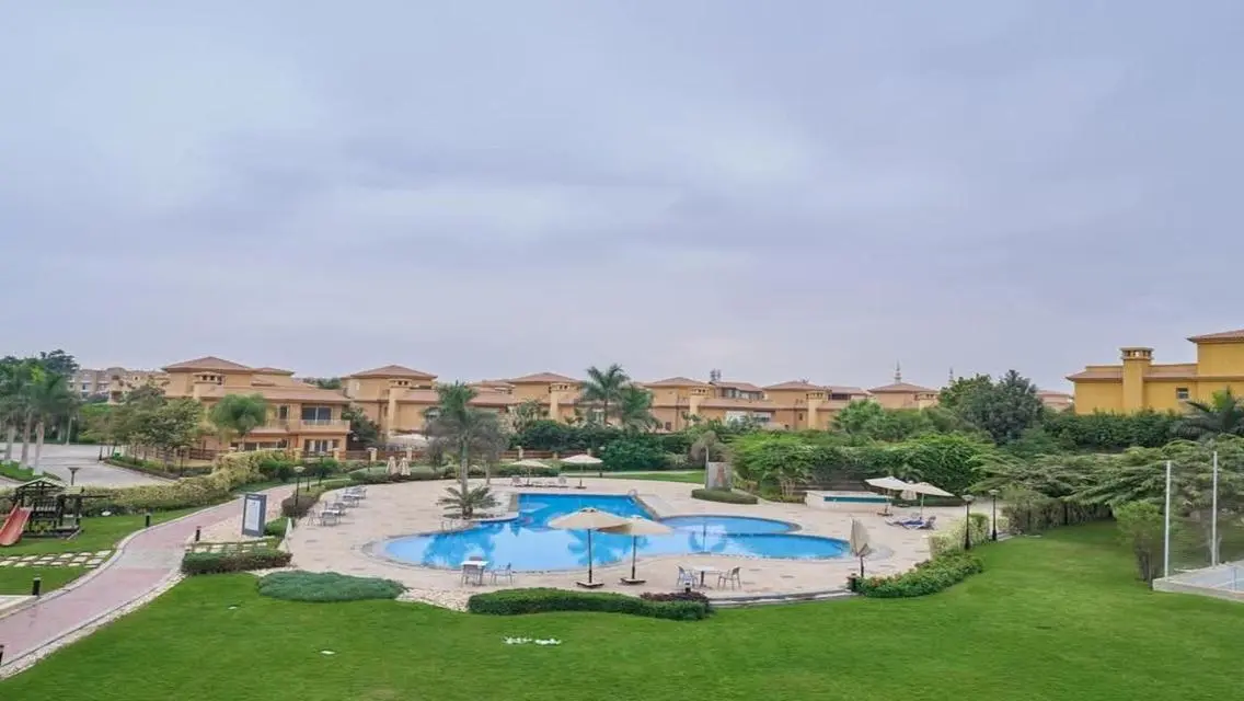 Luxurious Villa with Private Garden and Shared Pool in Prime Location