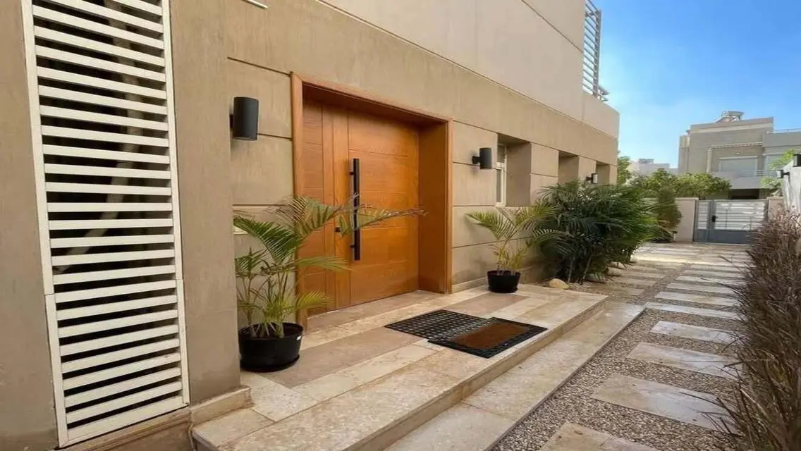Luxurious Villa with Private Garden and Shared Pool in Prime Location