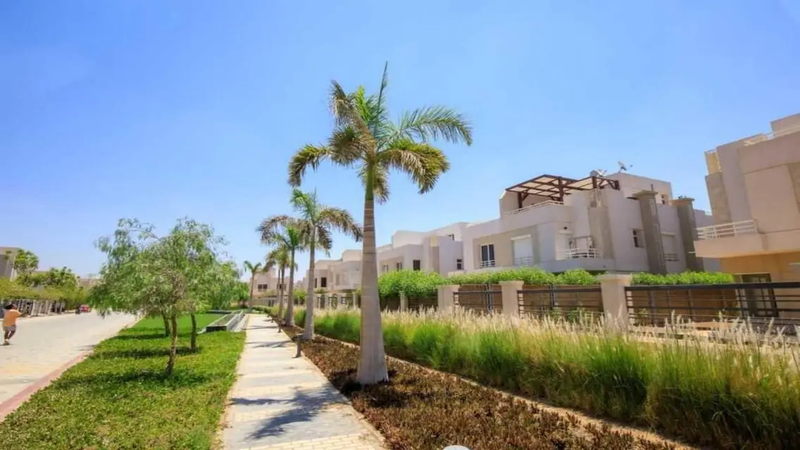 Luxurious Villa with Private Garden and Shared Pool in Prime Location