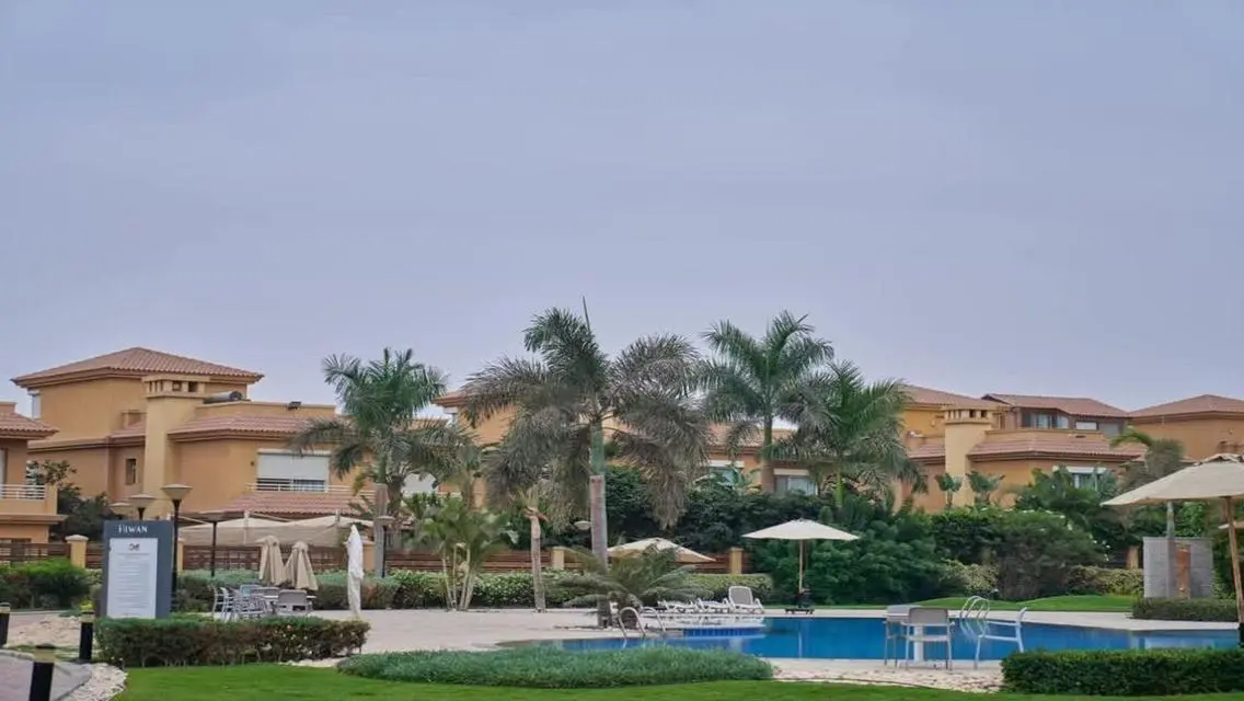 Luxurious Villa with Private Garden and Shared Pool in Prime Location