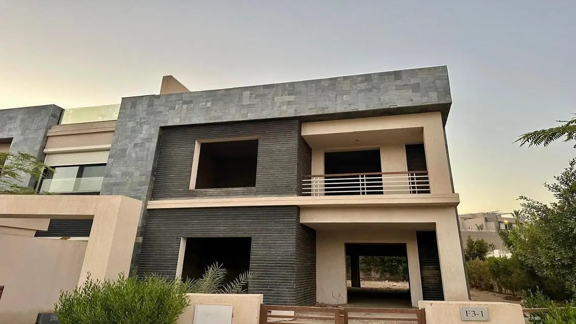 Luxury Apartment with Private Garden and Shared Pool in Prime Location