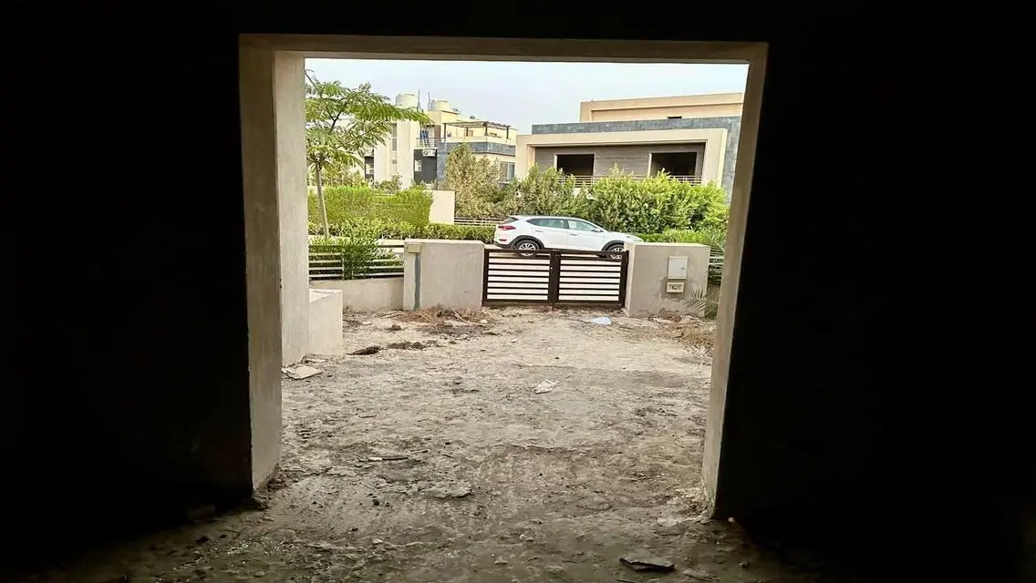 Luxury Apartment with Private Garden and Shared Pool in Prime Location