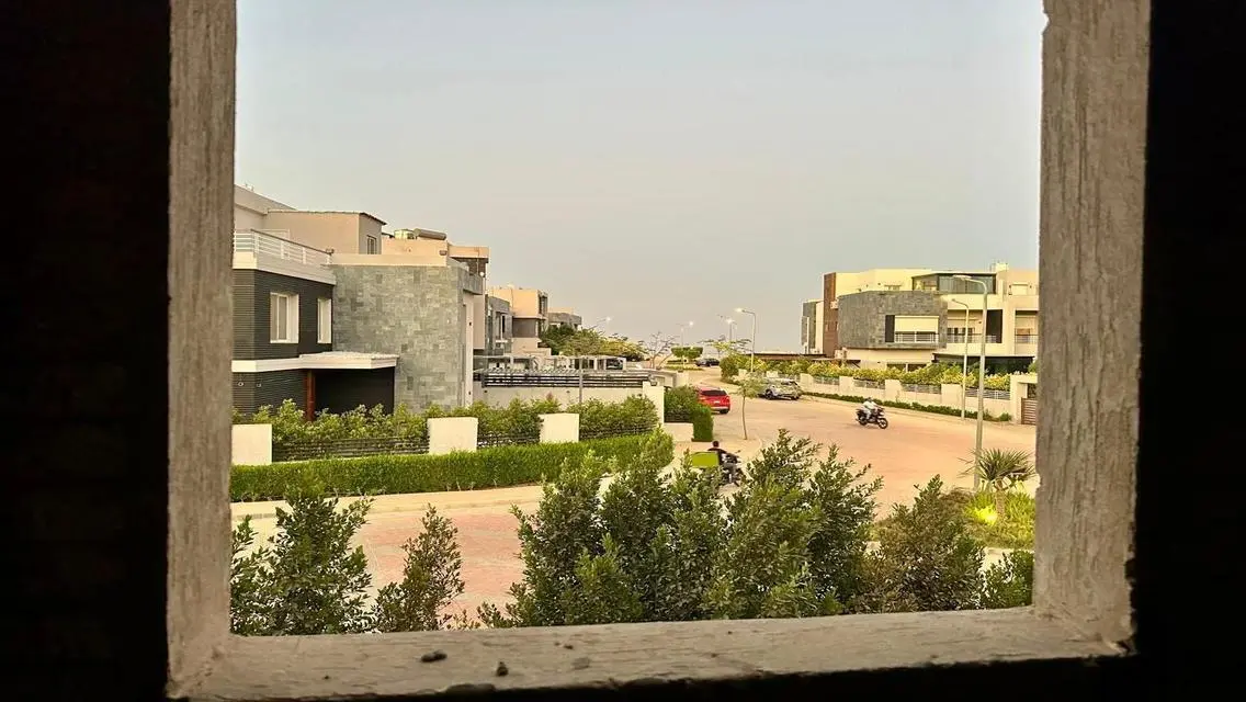 Luxury Apartment with Private Garden and Shared Pool in Prime Location
