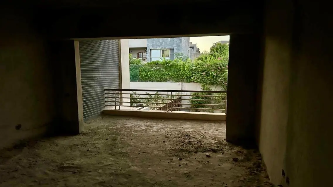 Luxury Apartment with Private Garden and Shared Pool in Prime Location