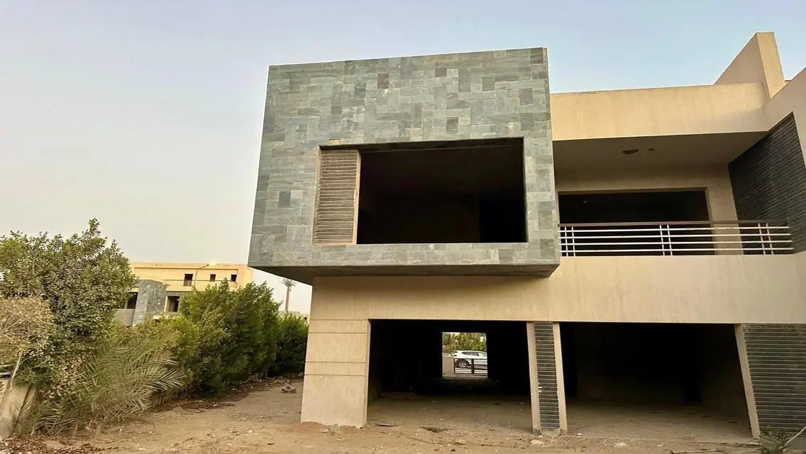 Luxury Apartment with Private Garden and Shared Pool in Prime Location