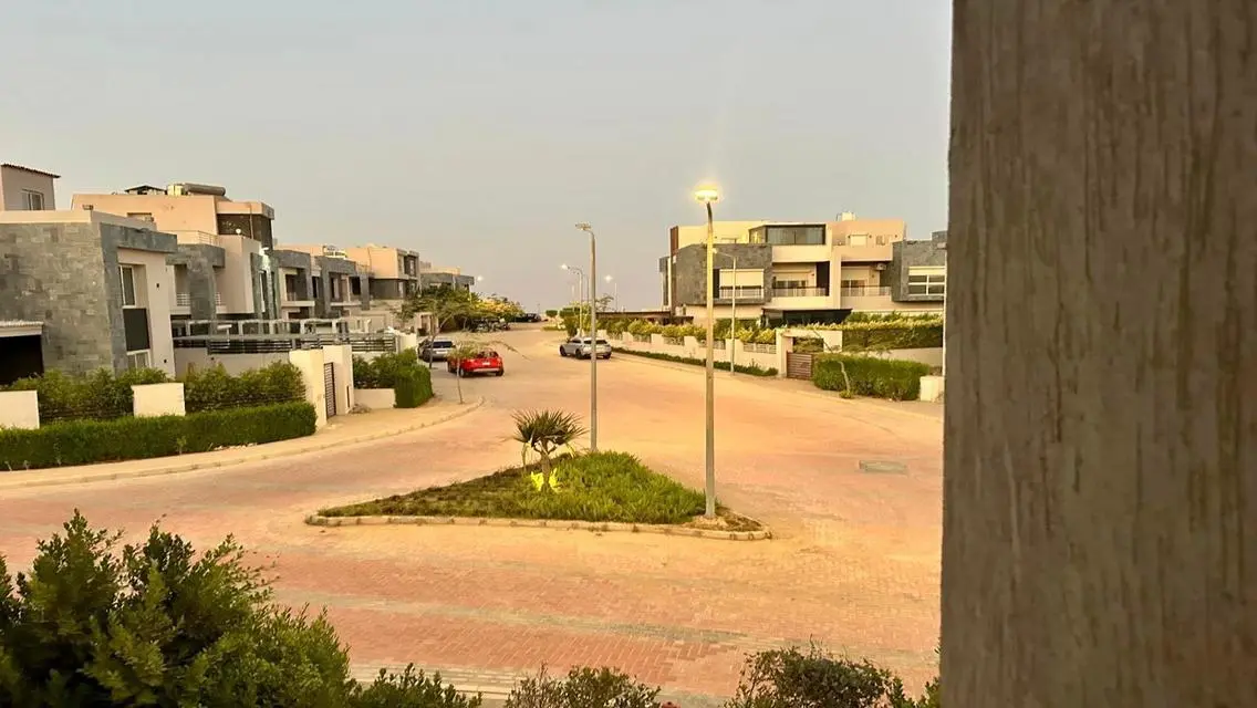 Luxury Apartment with Private Garden and Shared Pool in Prime Location