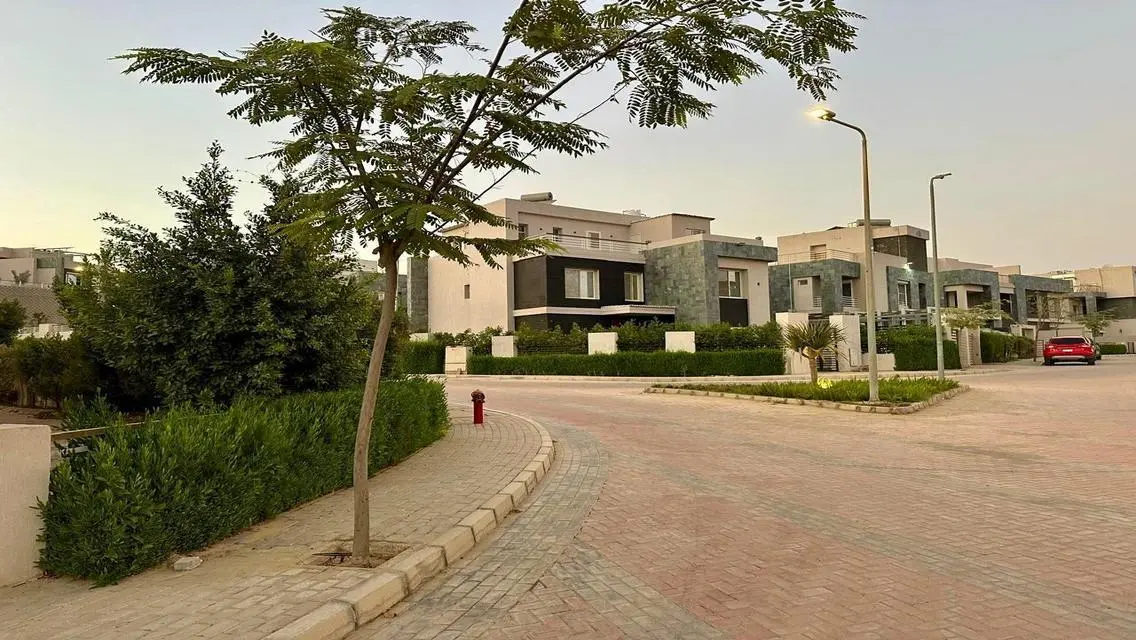 Luxury Apartment with Private Garden and Shared Pool in Prime Location