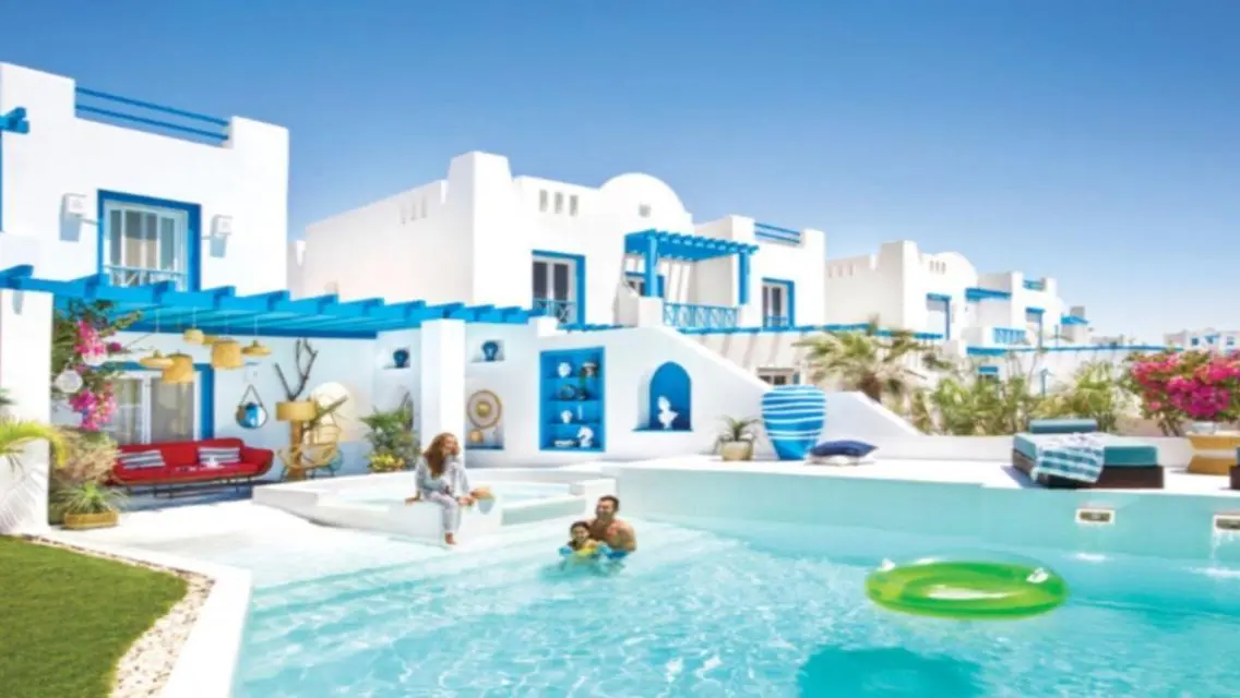 Luxury Villa with Private Garden and Shared Pool in Prime Location
