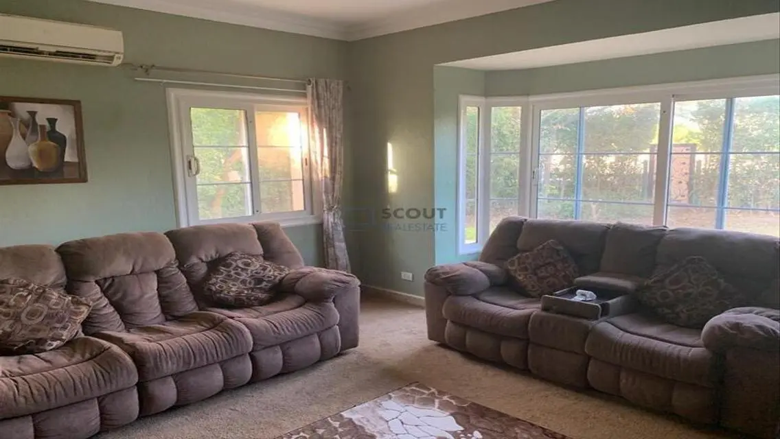 Luxury 4-Bedroom Apartment with Balcony and Shared Pool
