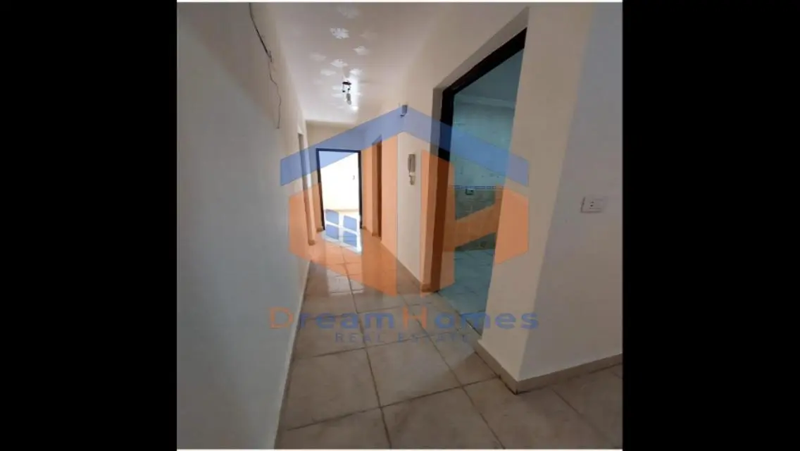 Luxury Apartment for Sale - 8000 Sq. M. with Maid's Room, Balcony, and Covered Parking