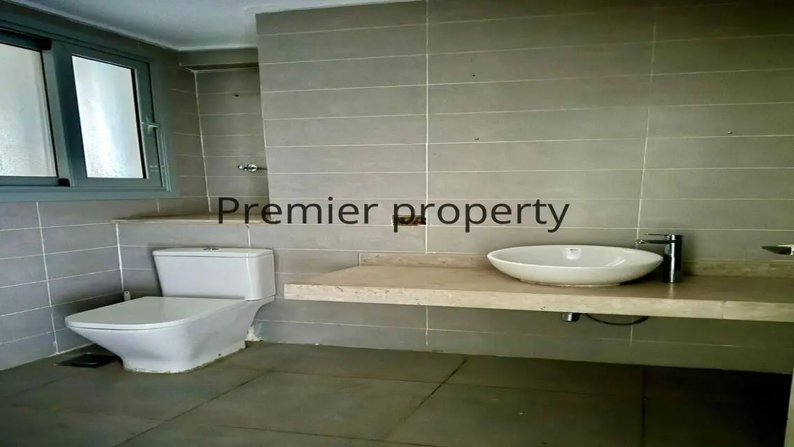 Stunning Apartment with Private Garden and Covered Parking for Sale