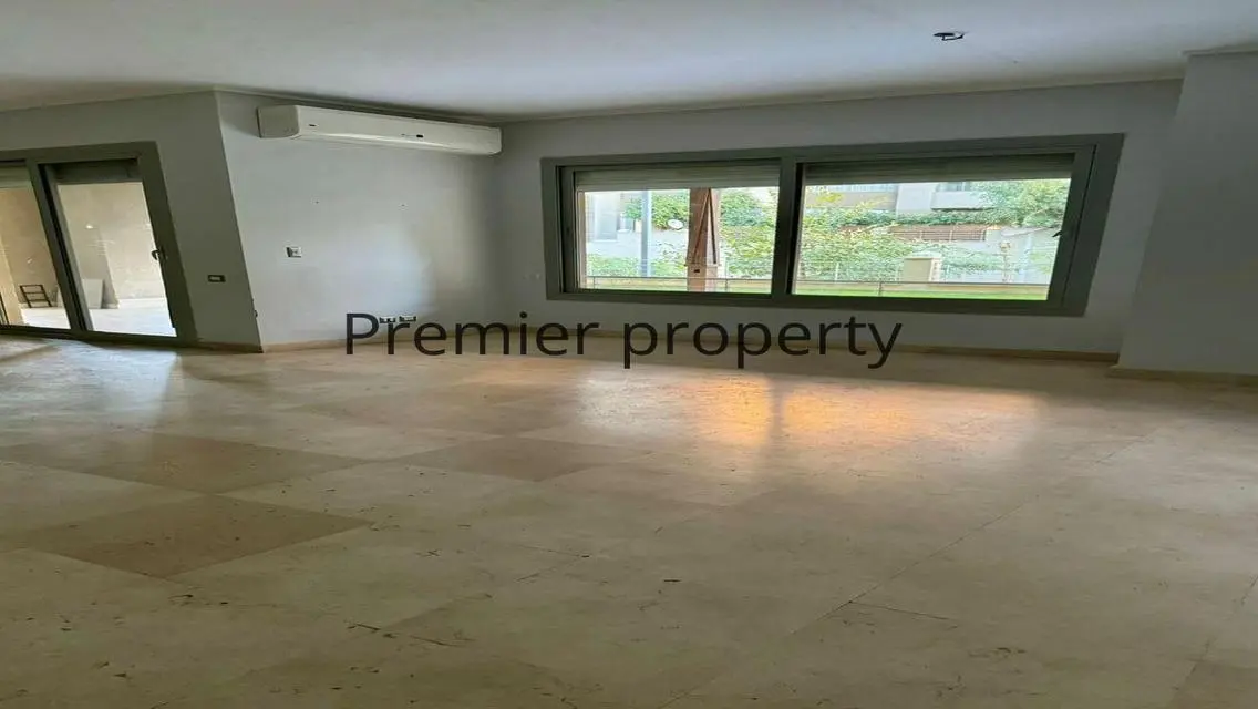 Stunning Apartment with Private Garden and Covered Parking for Sale