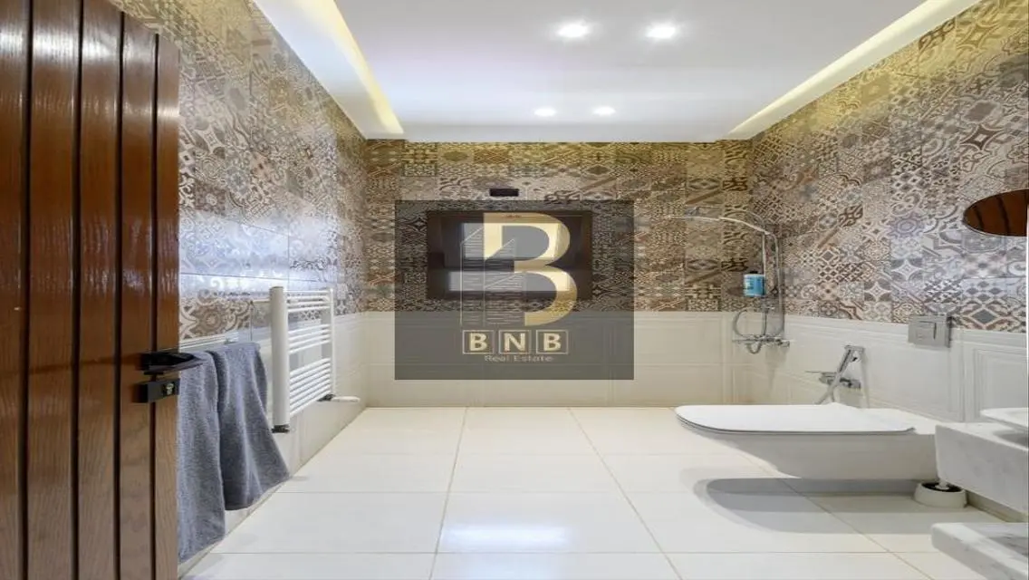 Luxurious 3-Bedroom Apartment with Private Garden and Shared Pool