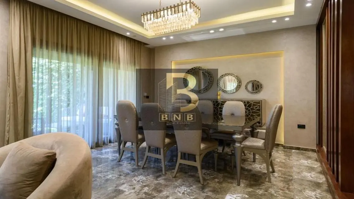 Luxurious 3-Bedroom Apartment with Private Garden and Shared Pool