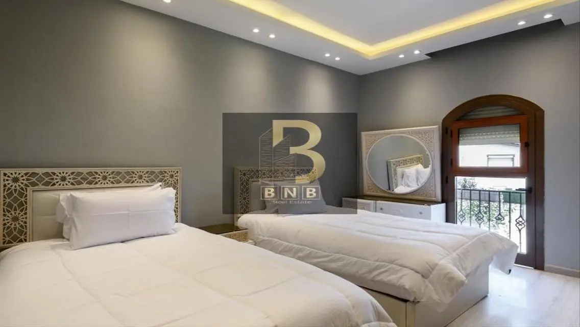 Luxurious 3-Bedroom Apartment with Private Garden and Shared Pool