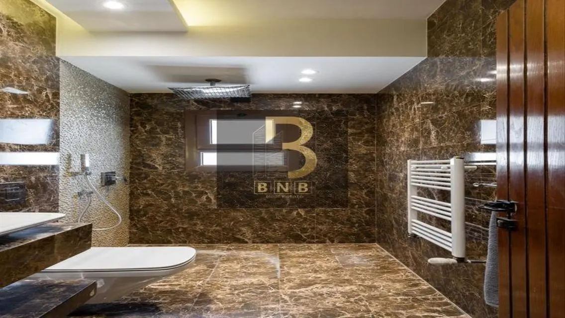 Luxurious 3-Bedroom Apartment with Private Garden and Shared Pool