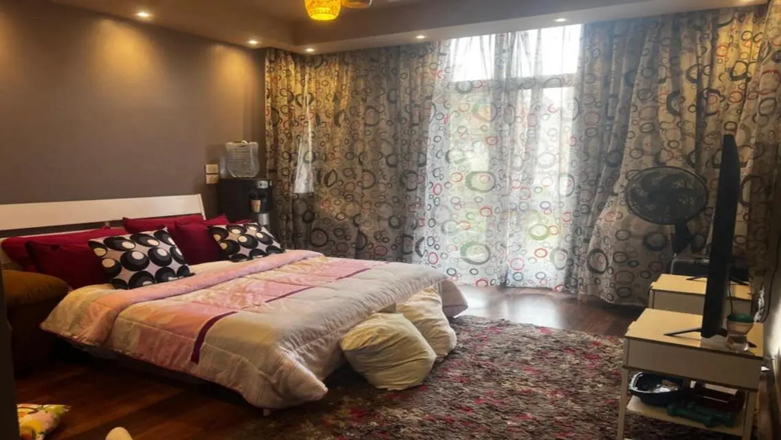 Luxury Apartment with Private Garden and Shared Pool in Prime Location