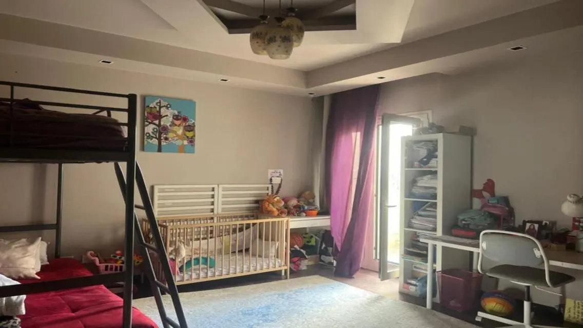 Luxury Apartment with Private Garden and Shared Pool in Prime Location