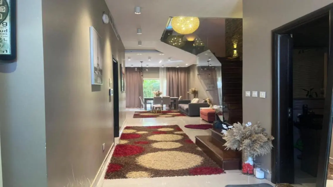 Luxury Apartment with Private Garden and Shared Pool in Prime Location