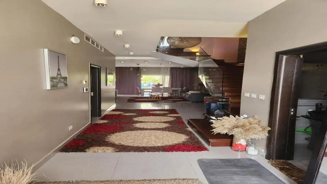 Luxury Apartment with Private Garden and Shared Pool in Prime Location