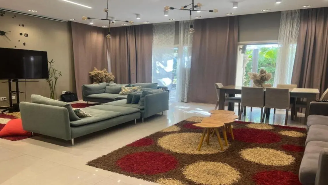 Luxury Apartment with Private Garden and Shared Pool in Prime Location
