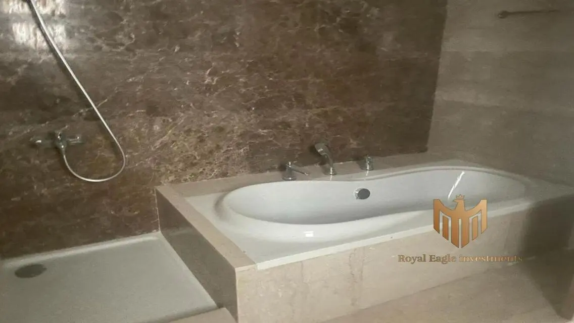 Luxurious 3-Bedroom Apartment with Maid's Room and Balcony