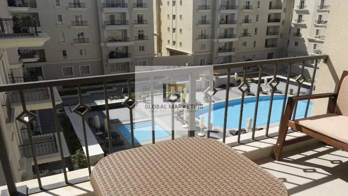 Charming Apartment with Balcony and Shared Pool for Sale