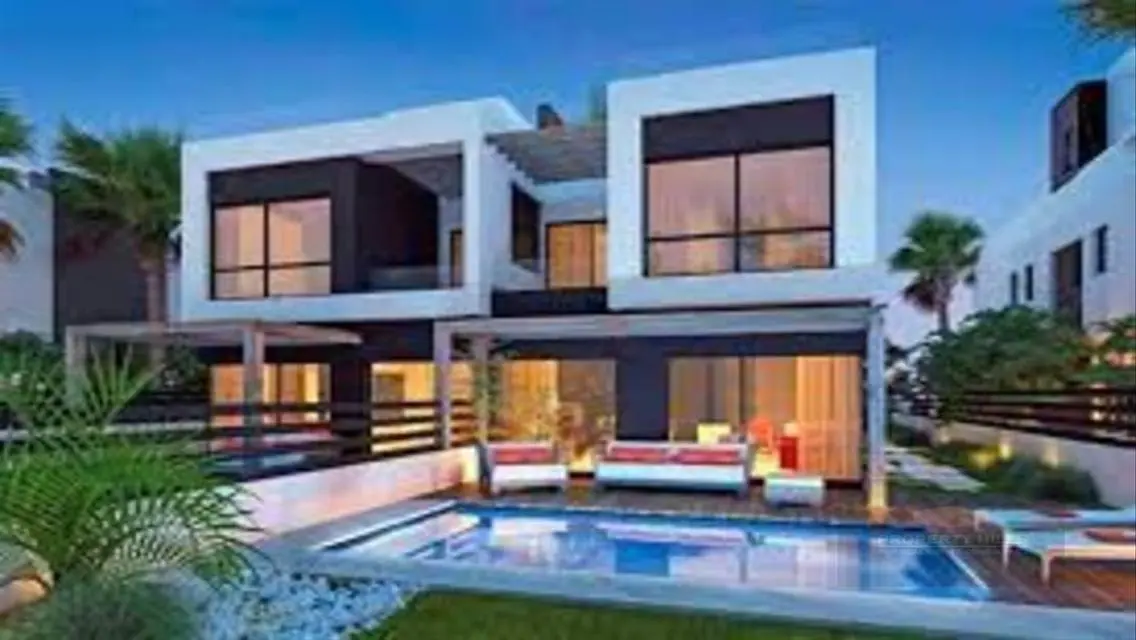 Luxury 4-Bedroom Apartment with Shared Pool and Private Garden
