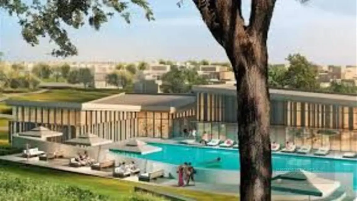 Luxury 4-Bedroom Apartment with Shared Pool and Private Garden