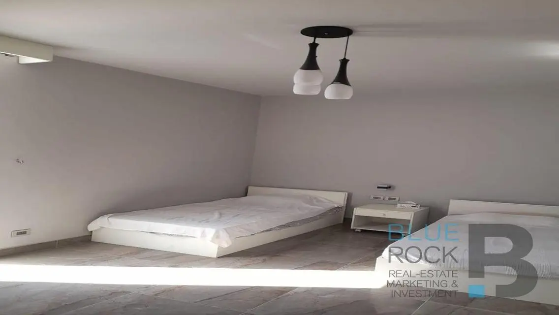 Luxury Apartment with Private Garden and Shared Pool