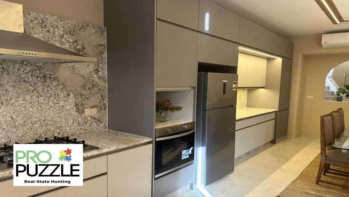 Luxury Apartment in AUC with Private Garden and Shared Pool