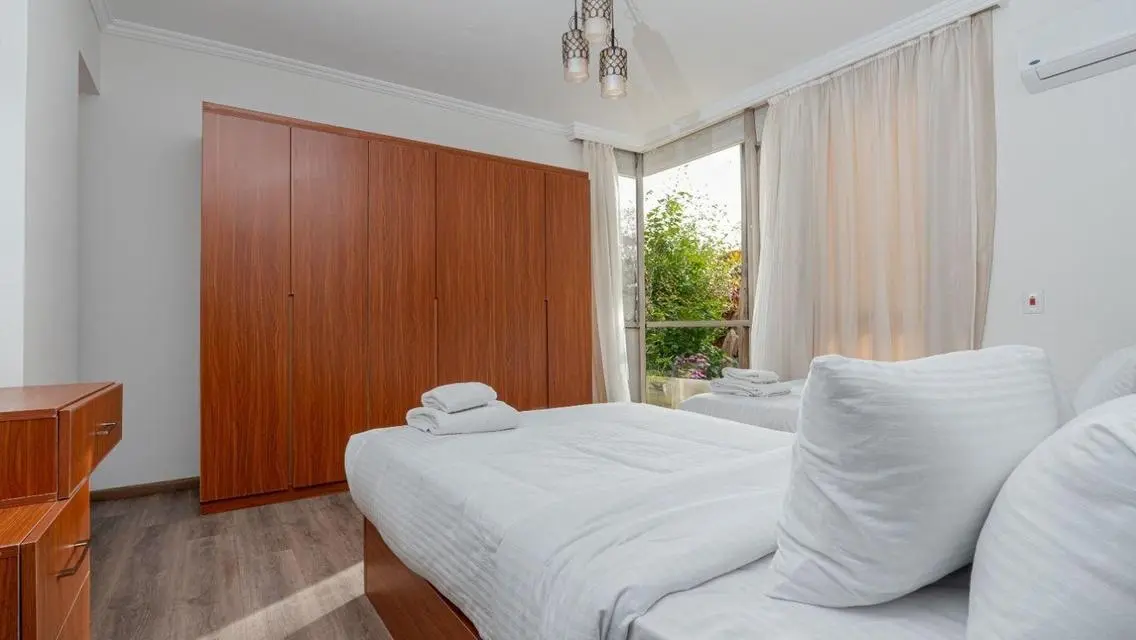 Stunning 3-Bedroom Apartment with Private Garden and Shared Pool