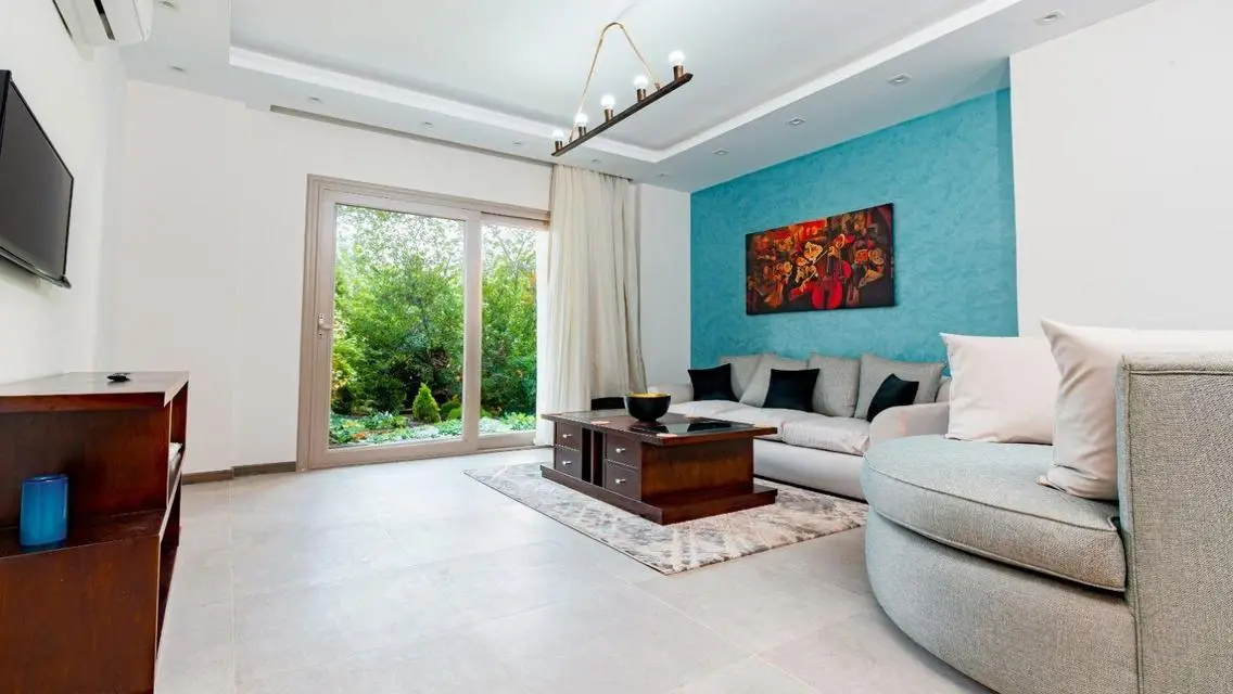 Stunning 3-Bedroom Apartment with Private Garden and Shared Pool